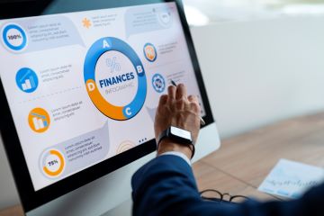 person office analyzing checking finance graphs